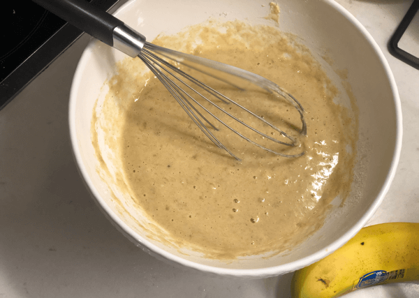 healthy banana pancake batter in bowl